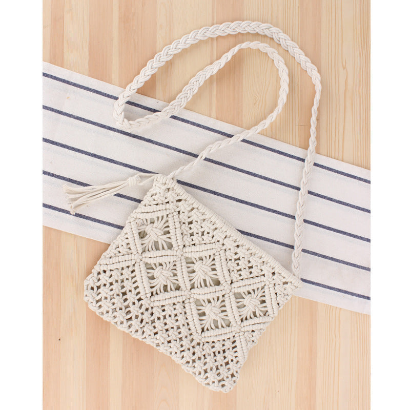 Small crocheted bag with a striped fabric background
