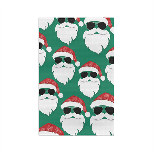 Cool Santa Aloha Kalikimaka kitchen towel with sunglasses Santa, tropical greenery and Christmas ornaments