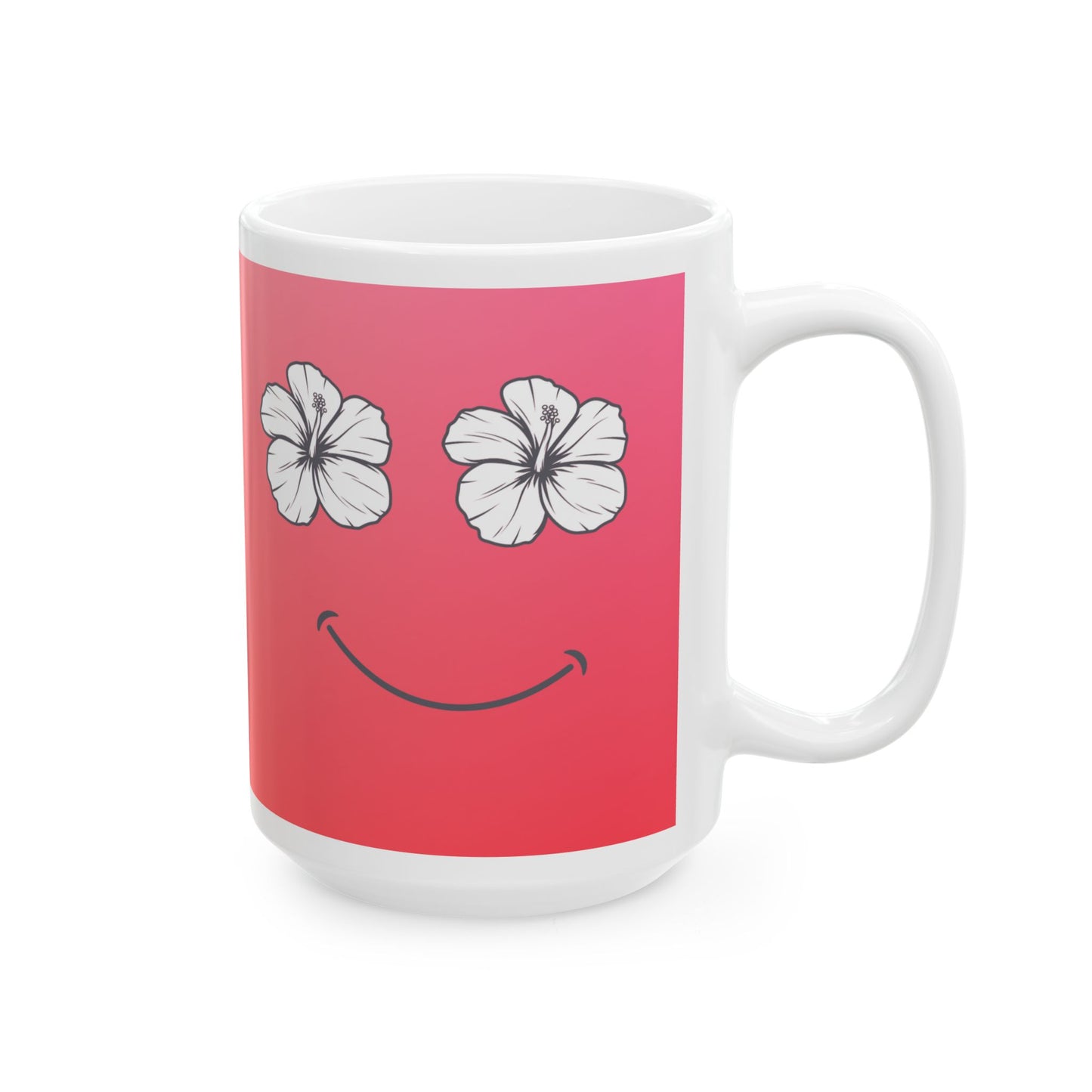 A white ceramic mug featuring a pink wrap-around graphic with two white hibiscus flowers for eyes and a black smiley mouth.
