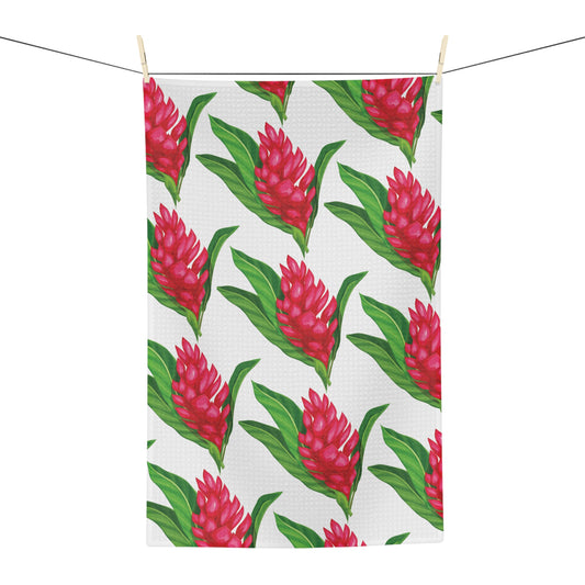 Red ginger Hawaiʻi kitchen towel with bright red tropical flowers and green leaves on white