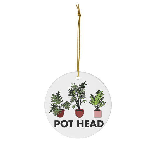 White ceramic Pot Head ornament featuring three illustrated tropical houseplants in colorful pots.