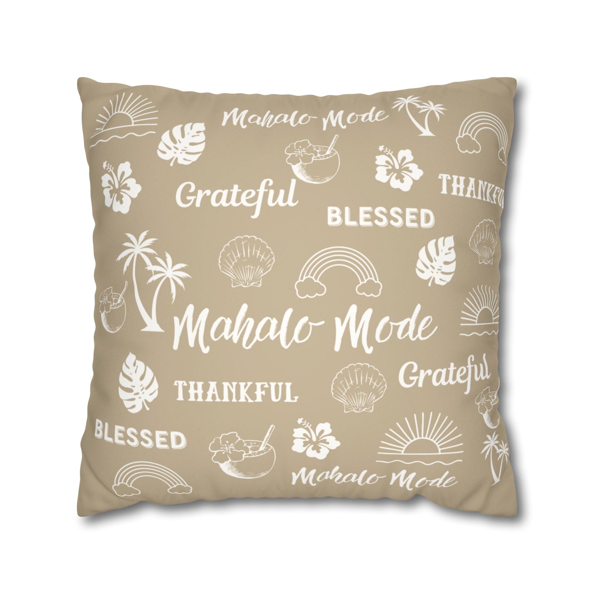 A square throw pillow in a warm beige color, printed with white tropical-themed illustrations and words including 'Mahalo Mode', 'Grateful', 'Blessed', and 'Thankful'.