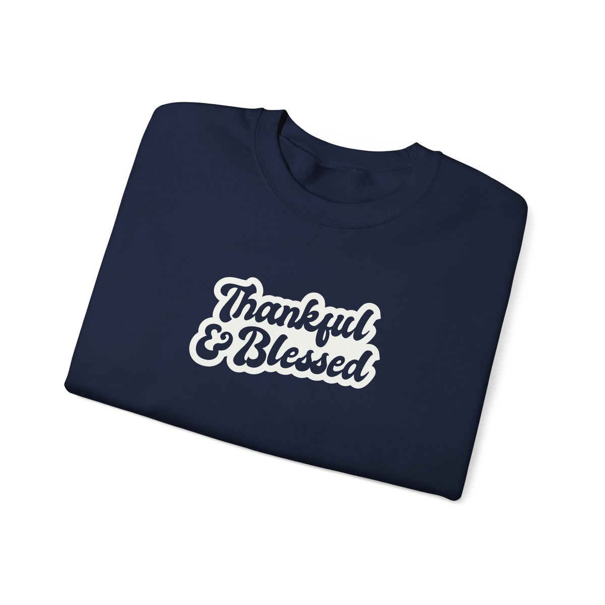 A folded navy crewneck sweatshirt with 'Thankful & Blessed' printed in white script with a brown outline on the front, set against a plain white background.