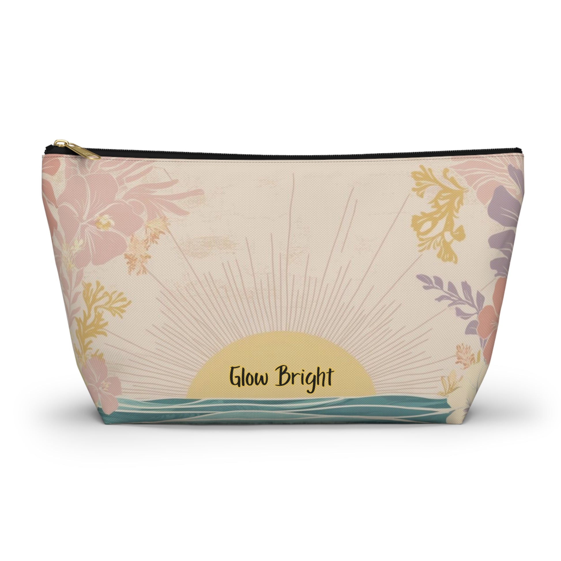 A rectangular cosmetic pouch with a gold zipper, featuring a retro sunset design with the text 'Glow Bright' in black script. The background of the pouch is a warm cream color decorated with pink tropical flowers, yellow botanical accents, and a teal wave pattern at the bottom.