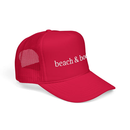 Red trucker hat with white embroidery 'beach & books'