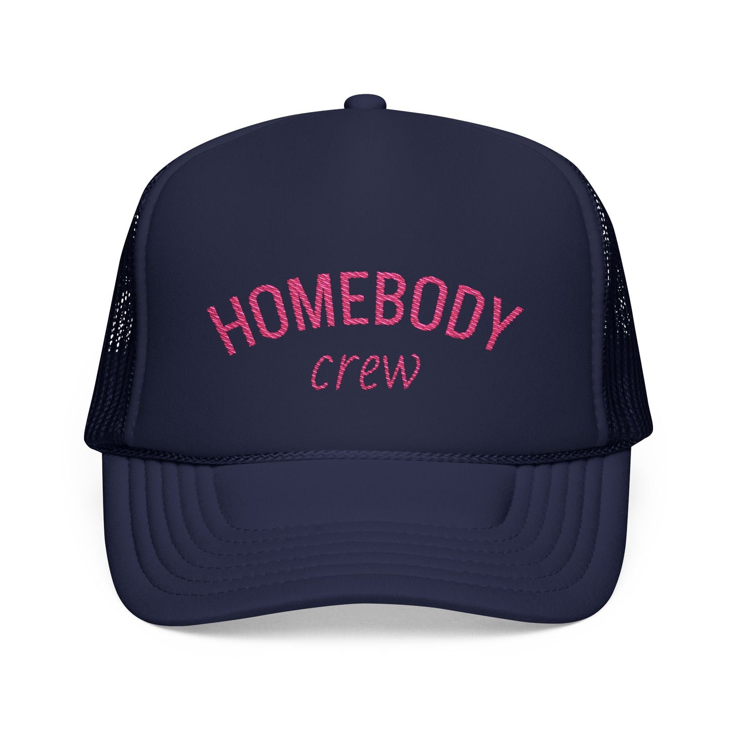 A navy blue trucker hat with pink embroidered text reading 'HOMEBODY crew' on the front panel, shown against a plain white background.