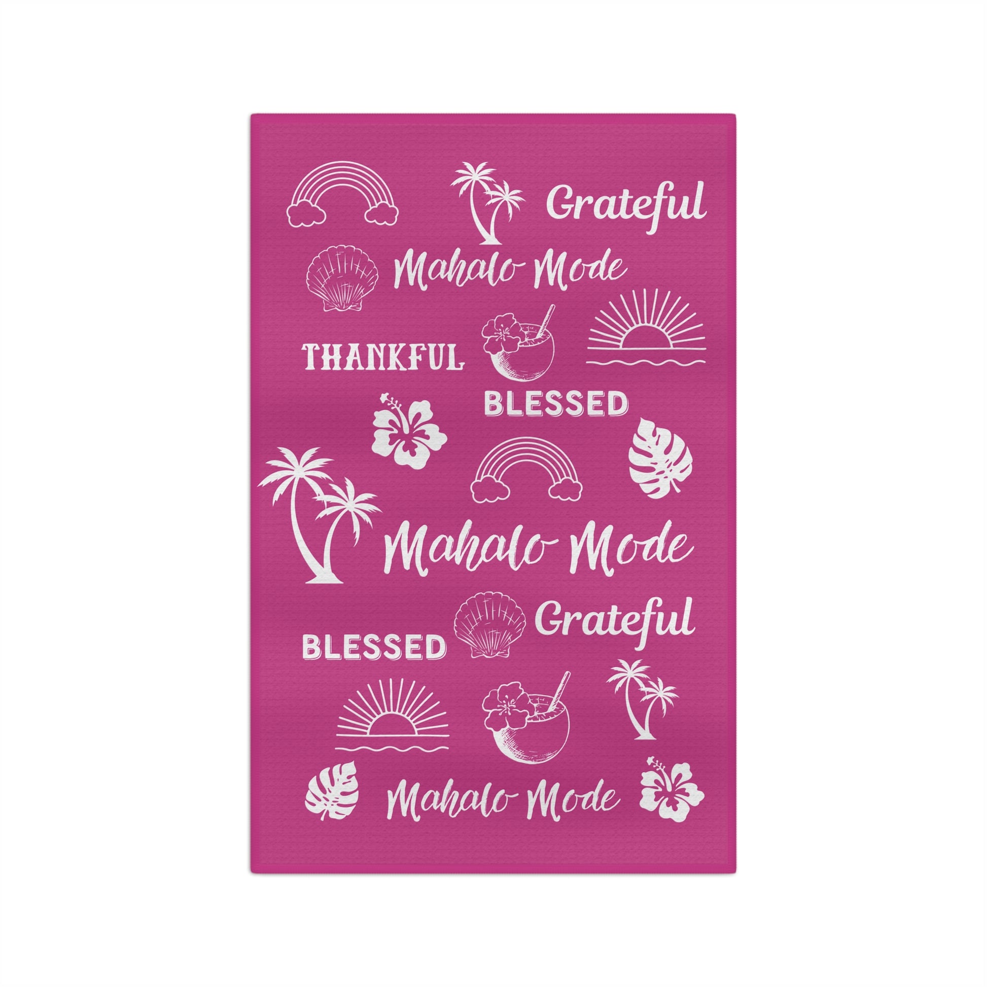 A raspberry pink kitchen towel featuring white tropical-themed illustrations and phrases including 'Grateful Mahalo Mode', 'THANKFUL', 'BLESSED', 'Grateful Mahalo Mode', and 'Mahalo Mode'.