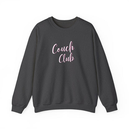 A dark gray crewneck sweatshirt featuring the words 'Couch Club' printed in a light pink cursive font on the chest, displayed against a solid white background.
