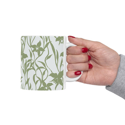 Woman holding mug Orchid Sage coffee mug with tropical orchid print by Global Village Kailua with white background.