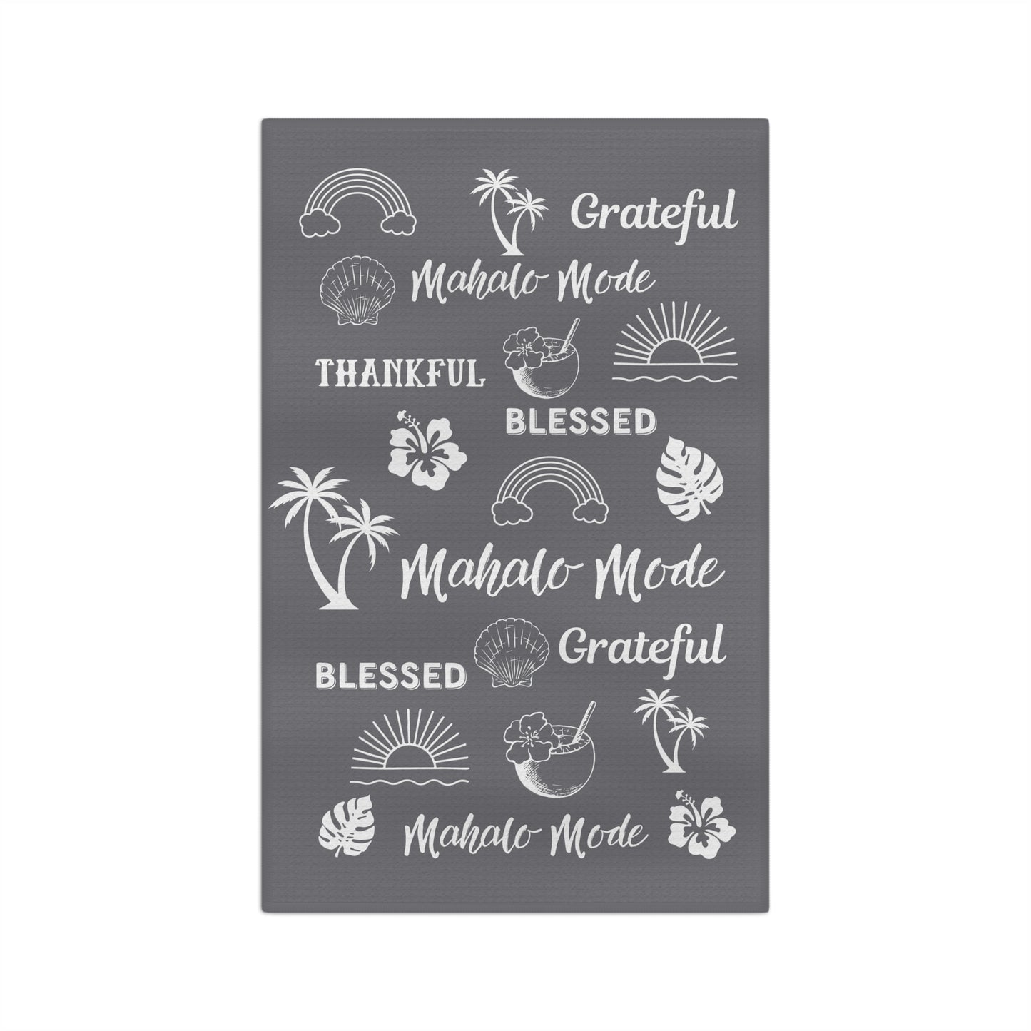 A gray micro fiber kitchen towel with white tropical-themed illustrations and phrases including rainbows, palm trees, hibiscus flowers, seashells, and the words 'Grateful,' 'Blessed,' and 'Mahalo Mode'