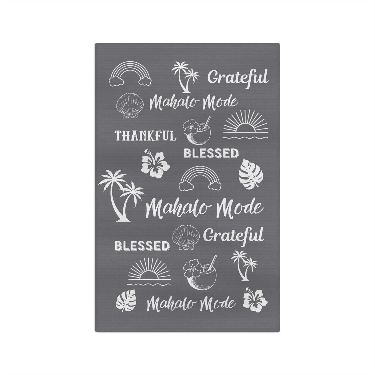 A gray micro fiber kitchen towel with white tropical-themed illustrations and phrases including rainbows, palm trees, hibiscus flowers, seashells, and the words 'Grateful,' 'Blessed,' and 'Mahalo Mode'