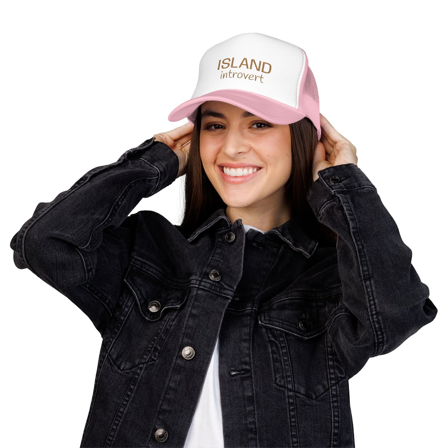 Person wearing a black denim jacket and pink cap with text 'island introvert' on a white background