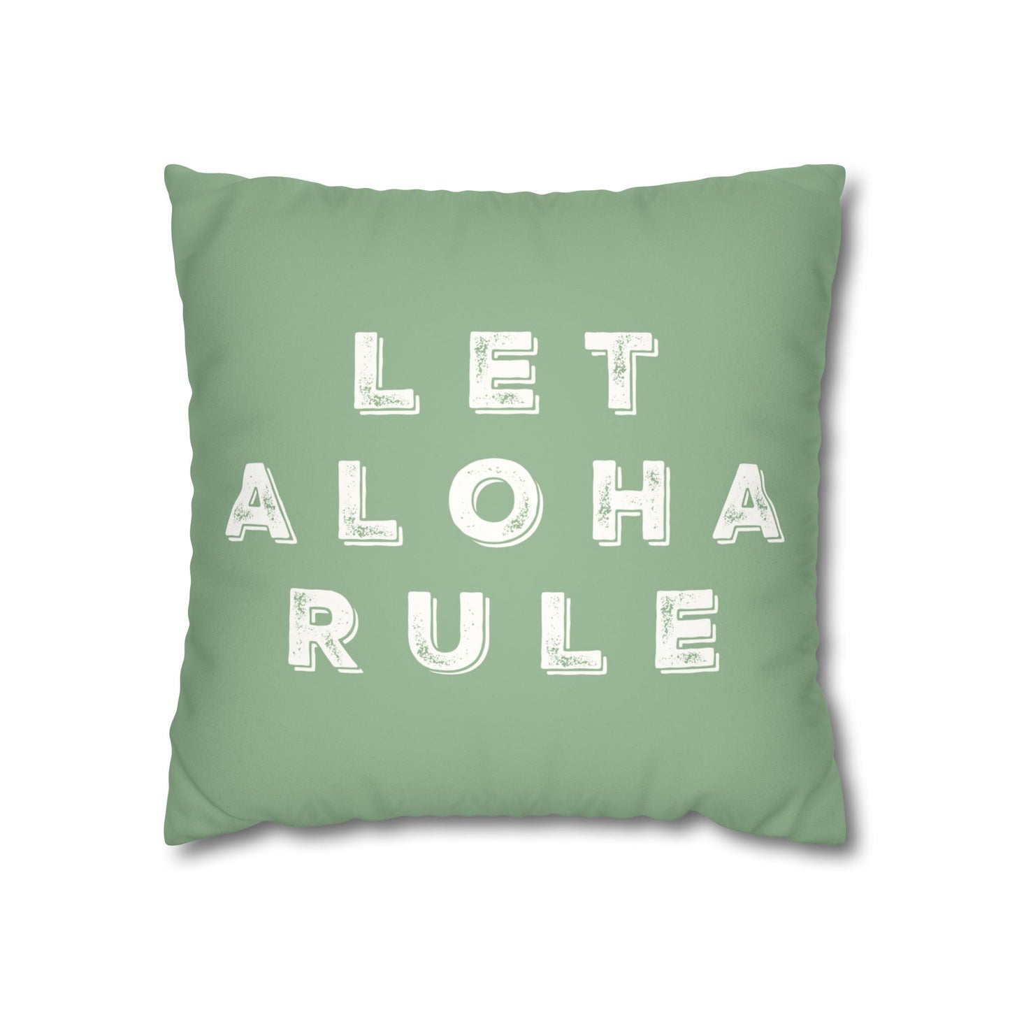 A square mint green throw pillow featuring the phrase 'LET ALOHA RULE' printed in distressed white block letters, shown against a plain white background.