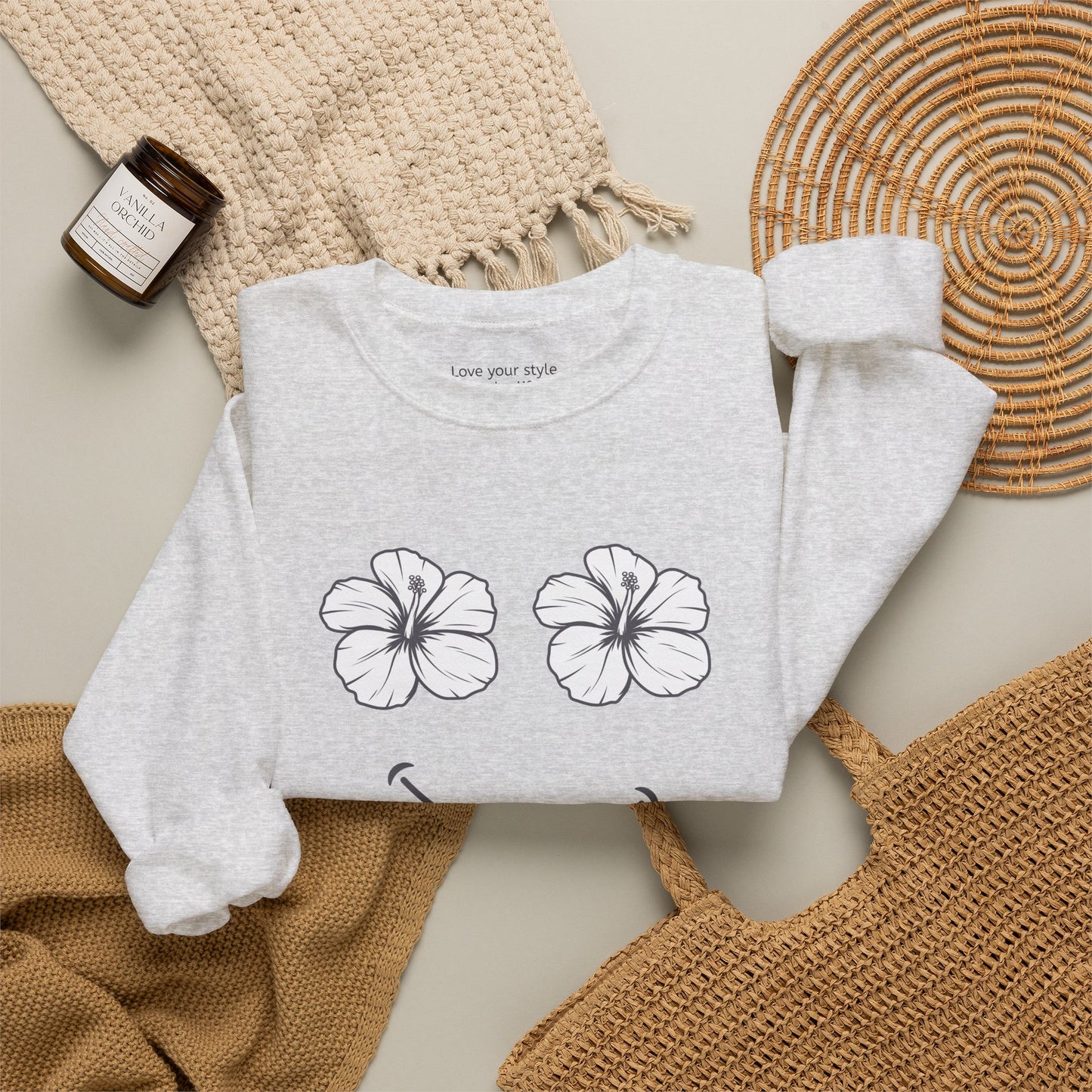 Grey folded Happy Hibiscus Sweatshirt featuring a cheerful hibiscus flower smile design inspired by island life and aloha style.