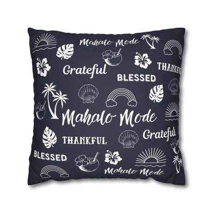 A square throw pillow in dark navy blue with a white tropical-themed print featuring the words 'Mahalo Mode', 'Grateful', 'Blessed', and 'Thankful' alongside palm trees, hibiscus flowers, seashells, rainbows, and sunsets.
