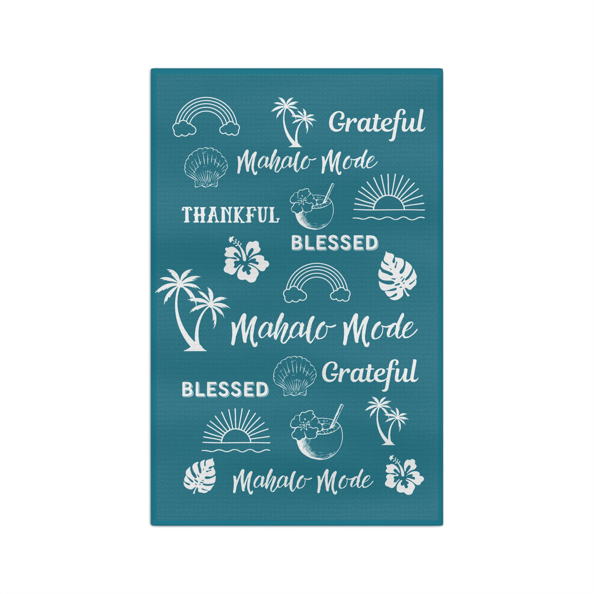 A rectangular teal kitchen towel featuring white tropical-themed illustrations and phrases including rainbows, palm trees, hibiscus flowers, seashells, sunsets, and repeated text reading 'Grateful Mahalo Mode' and 'Blessed Mahalo Mode' on a white background.
