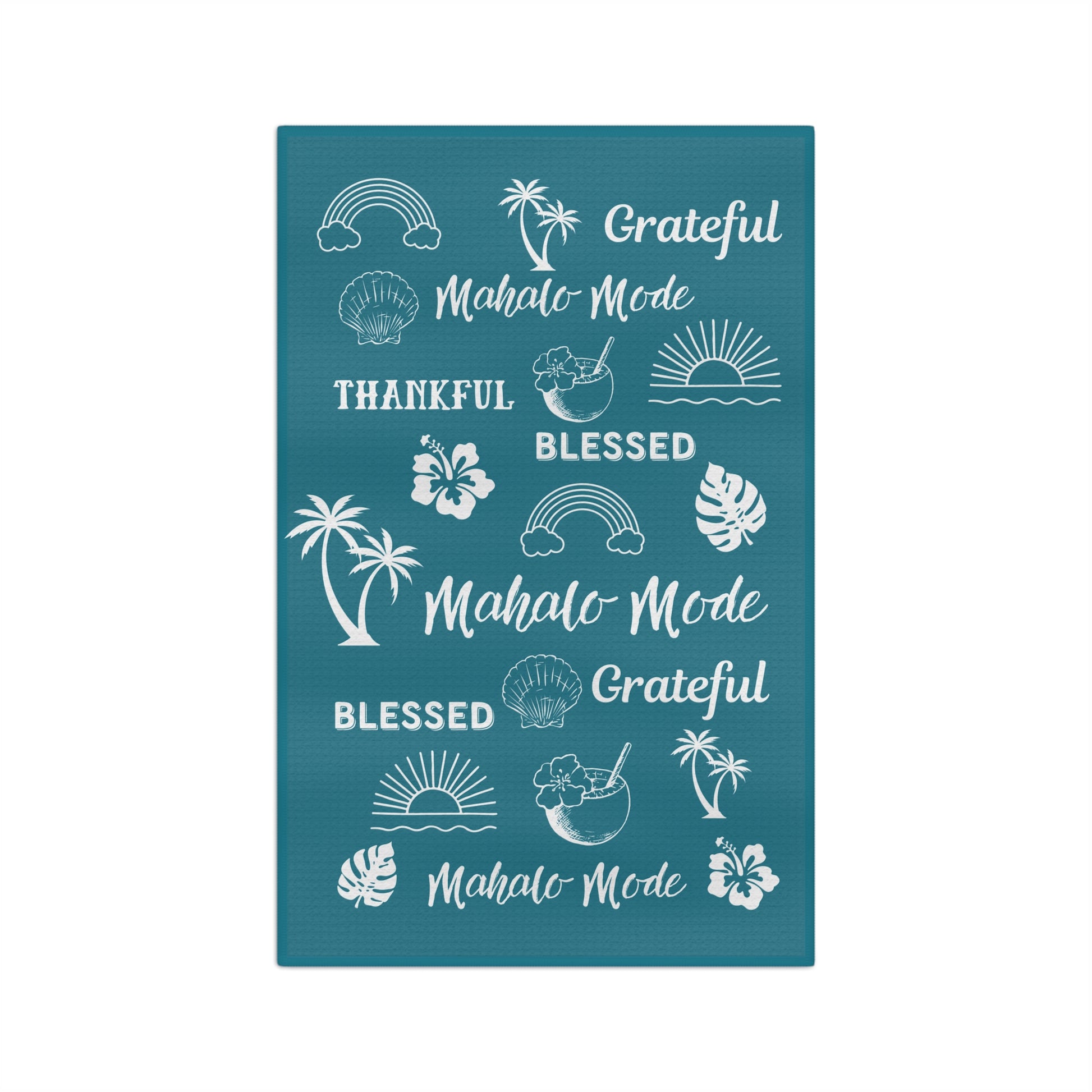 A rectangular teal kitchen towel featuring white tropical-themed illustrations and phrases including rainbows, palm trees, hibiscus flowers, seashells, sunsets, and repeated text reading 'Grateful Mahalo Mode' and 'Blessed Mahalo Mode' on a white background.