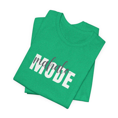 A folded green t-shirt with 'MAHALO MODE' printed in bold white letters and a gray script overlay reading 'mahalo', set against a plain white background.