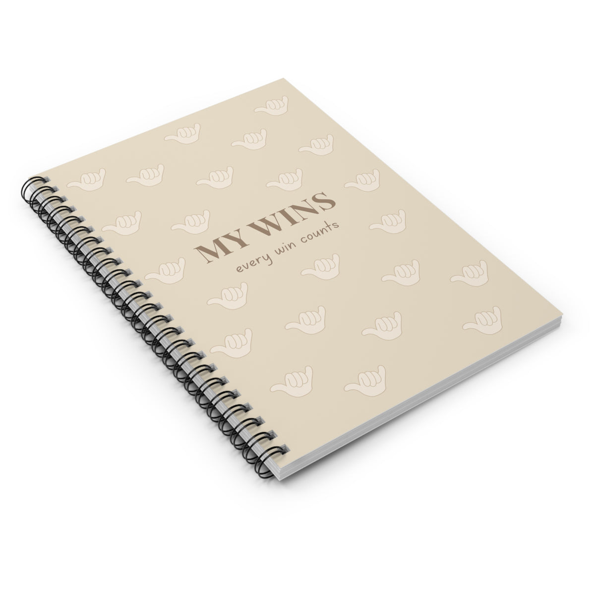 A beige spiral-bound notebook with a black wire binding, featuring the text 'MY WINS every win counts' and a repeating pattern of white shaka icons on the cover, shown against a plain white background.