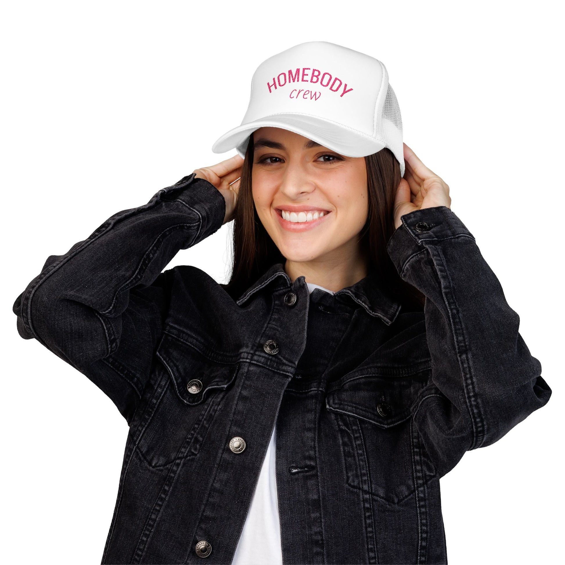 Person wearing a white cap with text 'HOMEBODY crew' and a black denim jacket on a white background