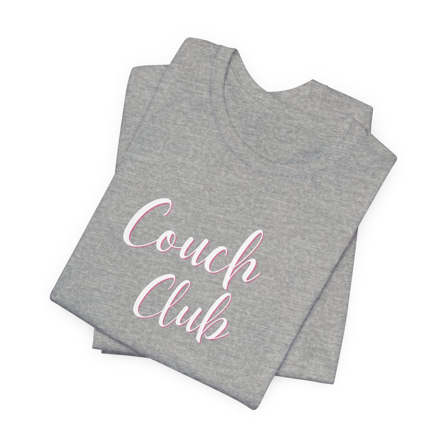 A folded heather gray t-shirt with 'Couch Club' printed in white script with a pink outline on the front, set against a plain white background.