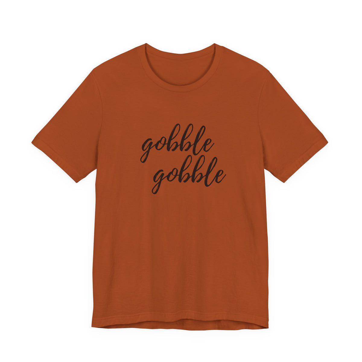 A rust short-sleeve crewneck t-shirt with the phrase 'gobble gobble' printed in black cursive script across the chest, displayed on a solid white background.