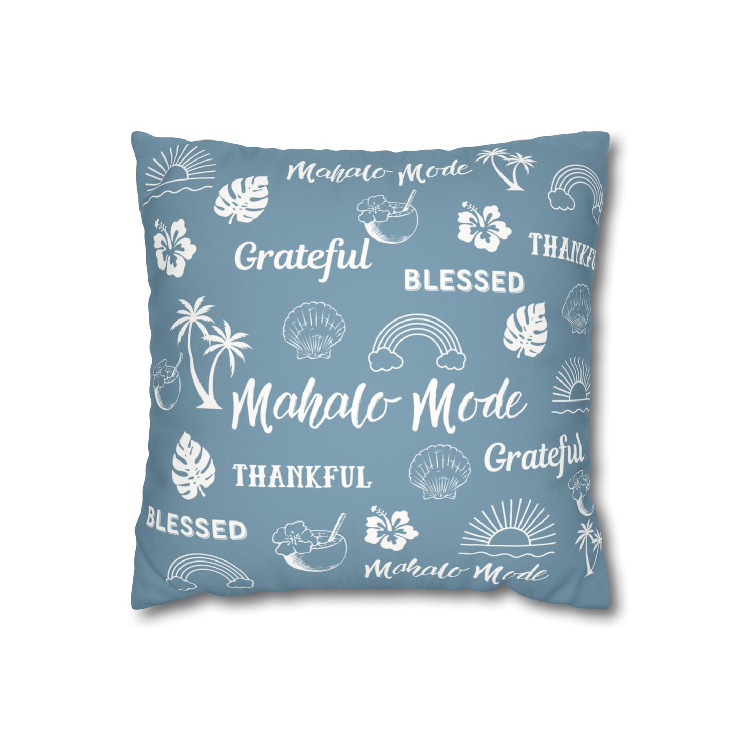 A square throw pillow in dusty blue with a white tropical-themed print featuring palm trees, hibiscus flowers, seashells, sunsets, and words like 'Mahalo Mode', 'Grateful', and 'Blessed'.