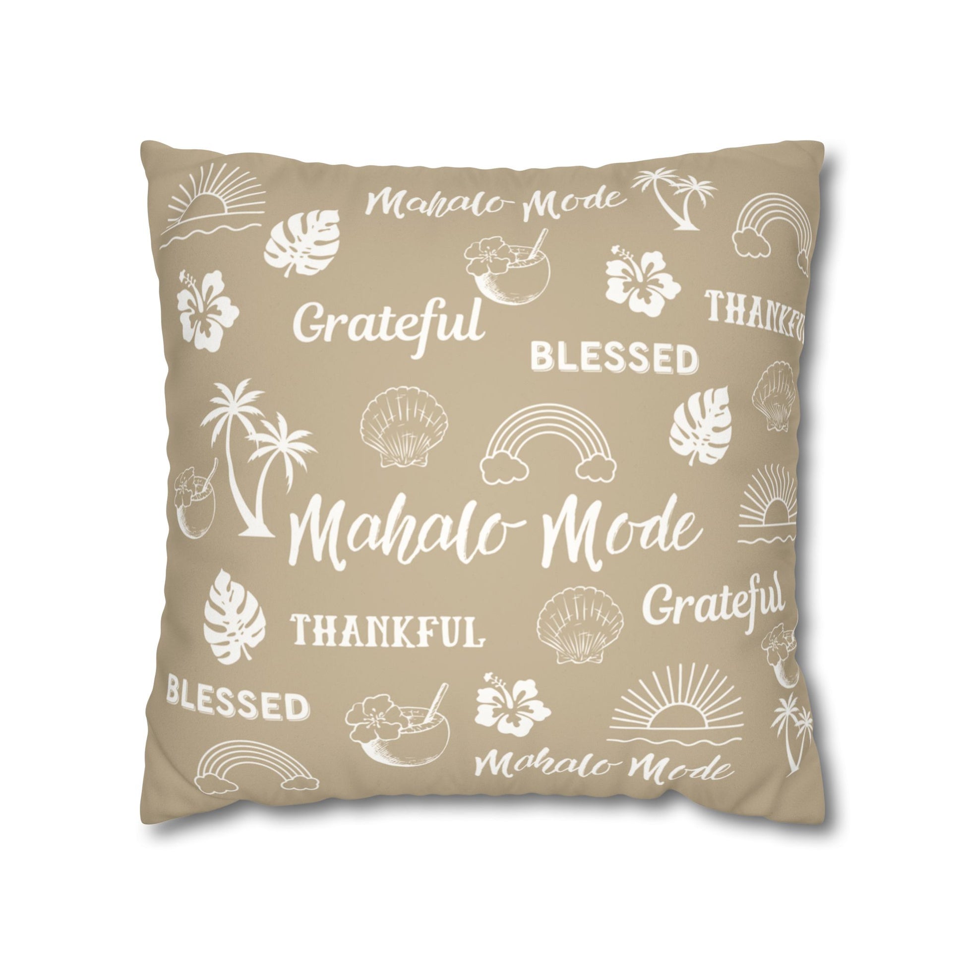 A square throw pillow in a warm beige color, decorated with white tropical-themed illustrations and words including 'Mahalo Mode', 'Grateful', 'Blessed', and 'Thankful'.