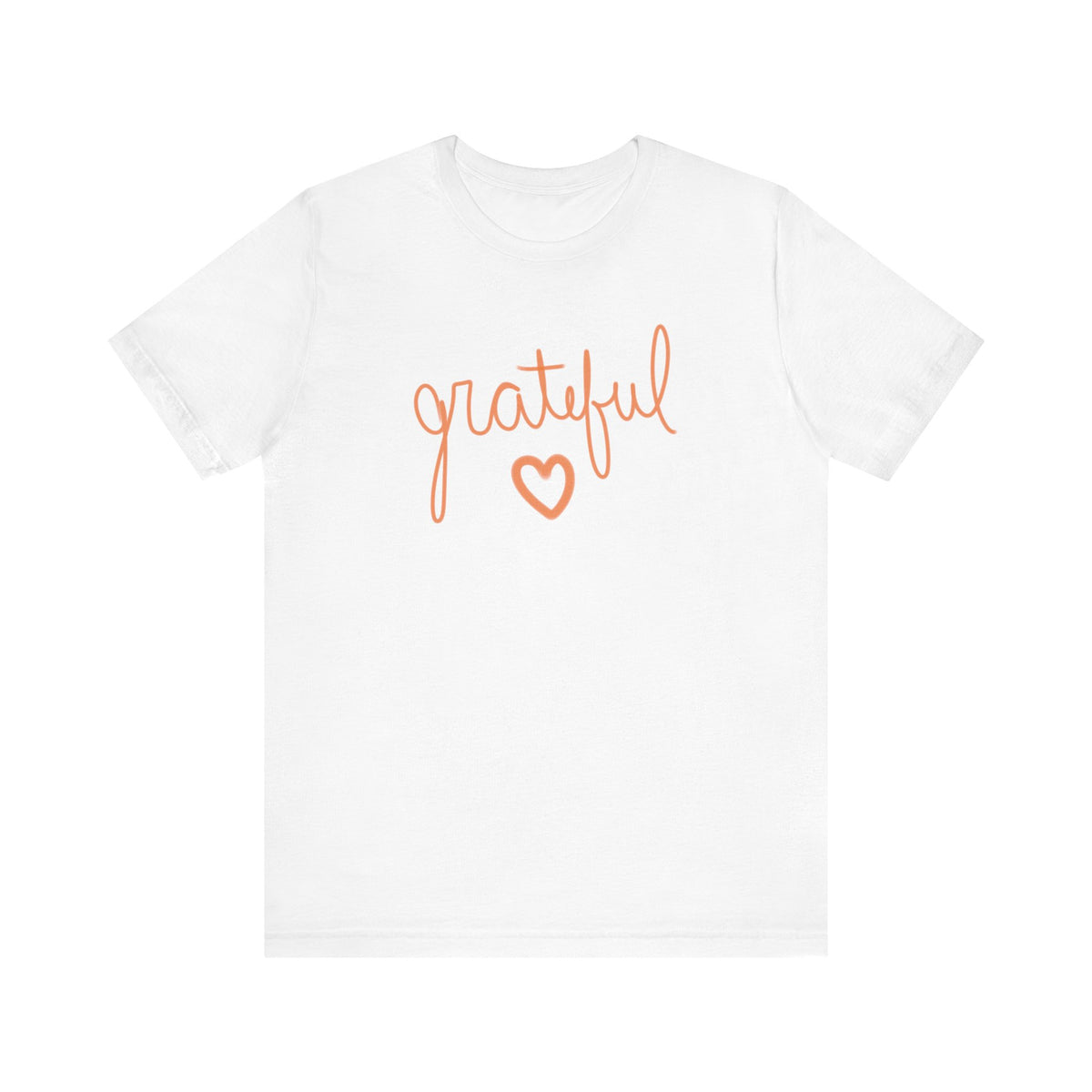 A white short-sleeve crewneck t-shirt featuring the word 'grateful' in orange cursive script and a matching orange heart outline on the chest, displayed against a solid white background.