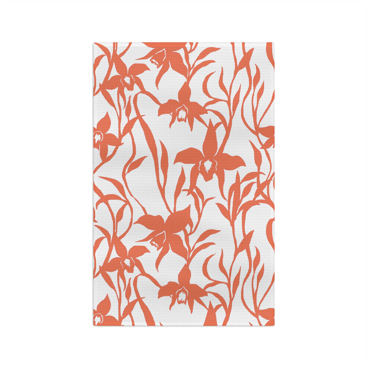 A rectangular white kitchen towel or tea towel featuring a bold coral orange floral pattern of orchids and leaves, shown flat against a solid white background.