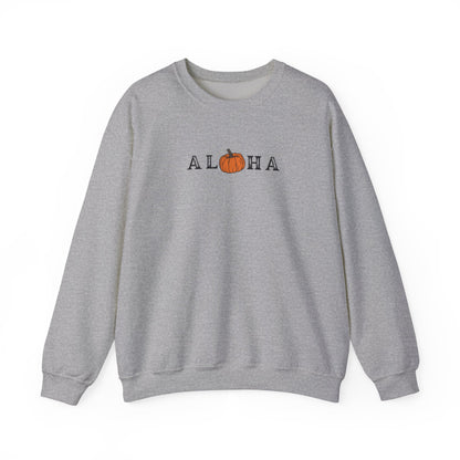 A heather grey crewneck sweatshirt featuring a graphic print of the word 'ALOHA' with the letter 'O' replaced by an orange pumpkin illustration, set against a plain white background.