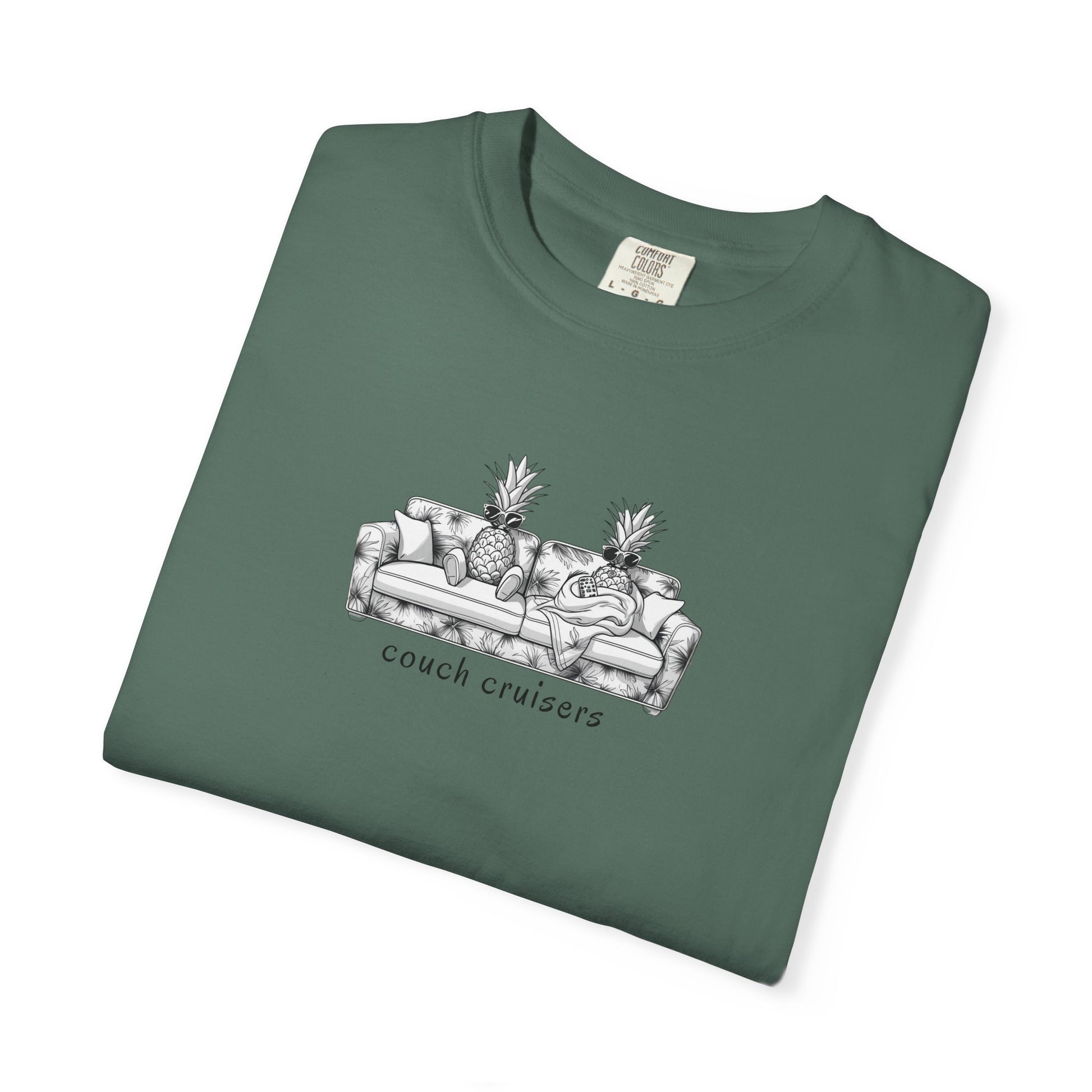 Folded Couch Cruisers graphic Comfort Colors tee in green with pineapple couch design