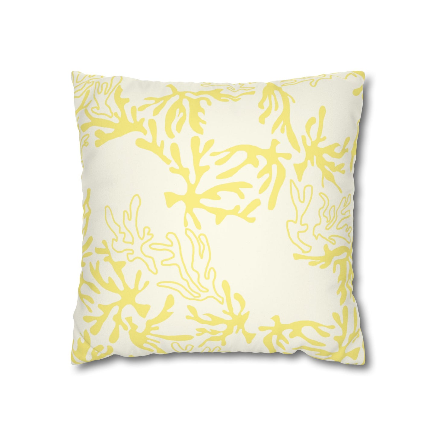 A square decorative throw pillow with a yellow coral or seaweed-like abstract pattern on an off-white background, shown against a plain white studio backdrop.