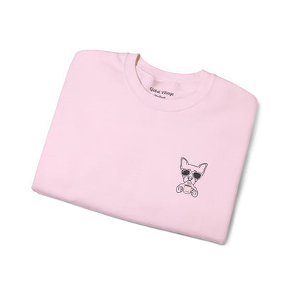 Folded light pink sweatshirt with an embroidered dog drinking a cup of coffee on a white background
