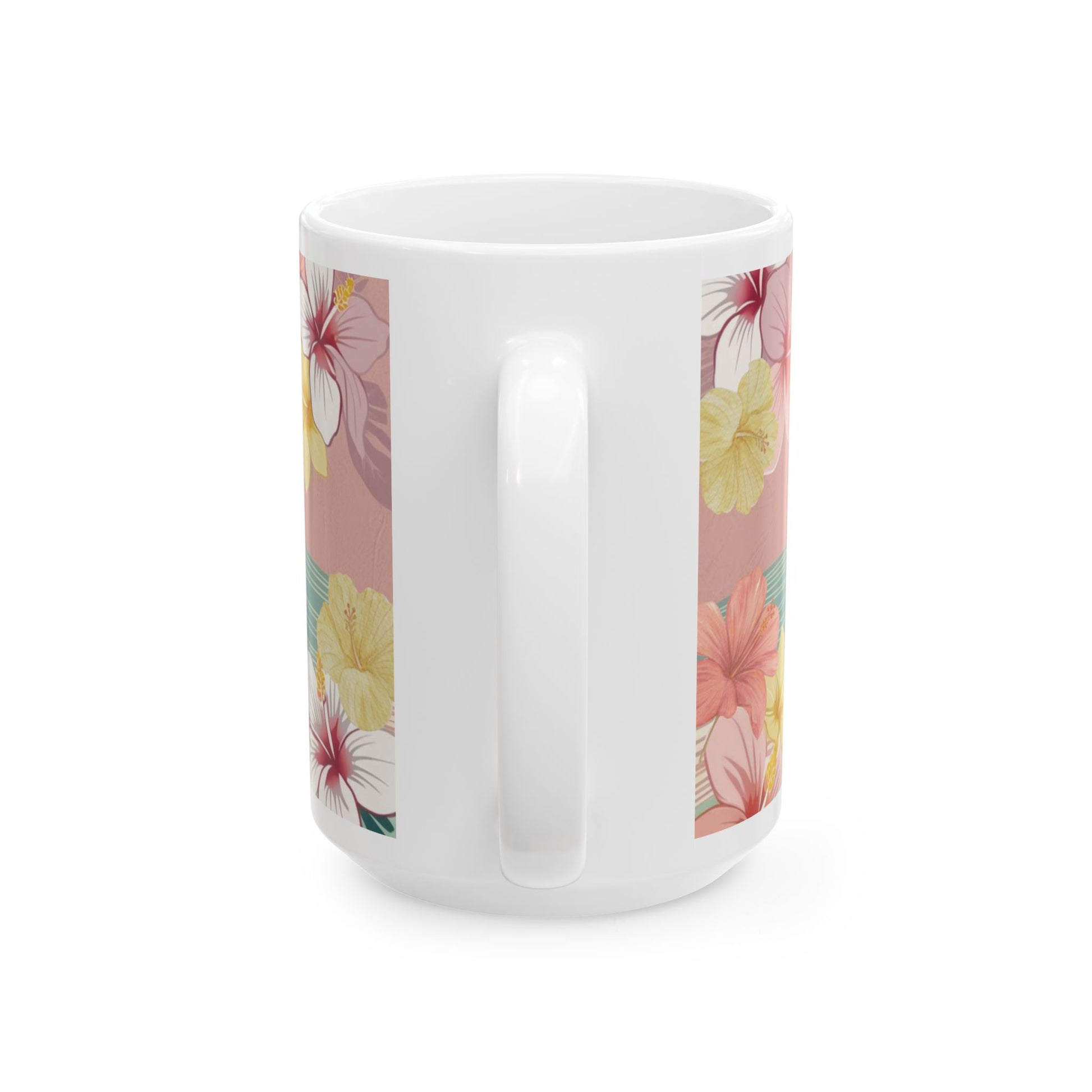 A white ceramic mug featuring a tropical floral print with pink, yellow, and red hibiscus flowers on a dusty pink background, shown from a side angle against a white studio background.