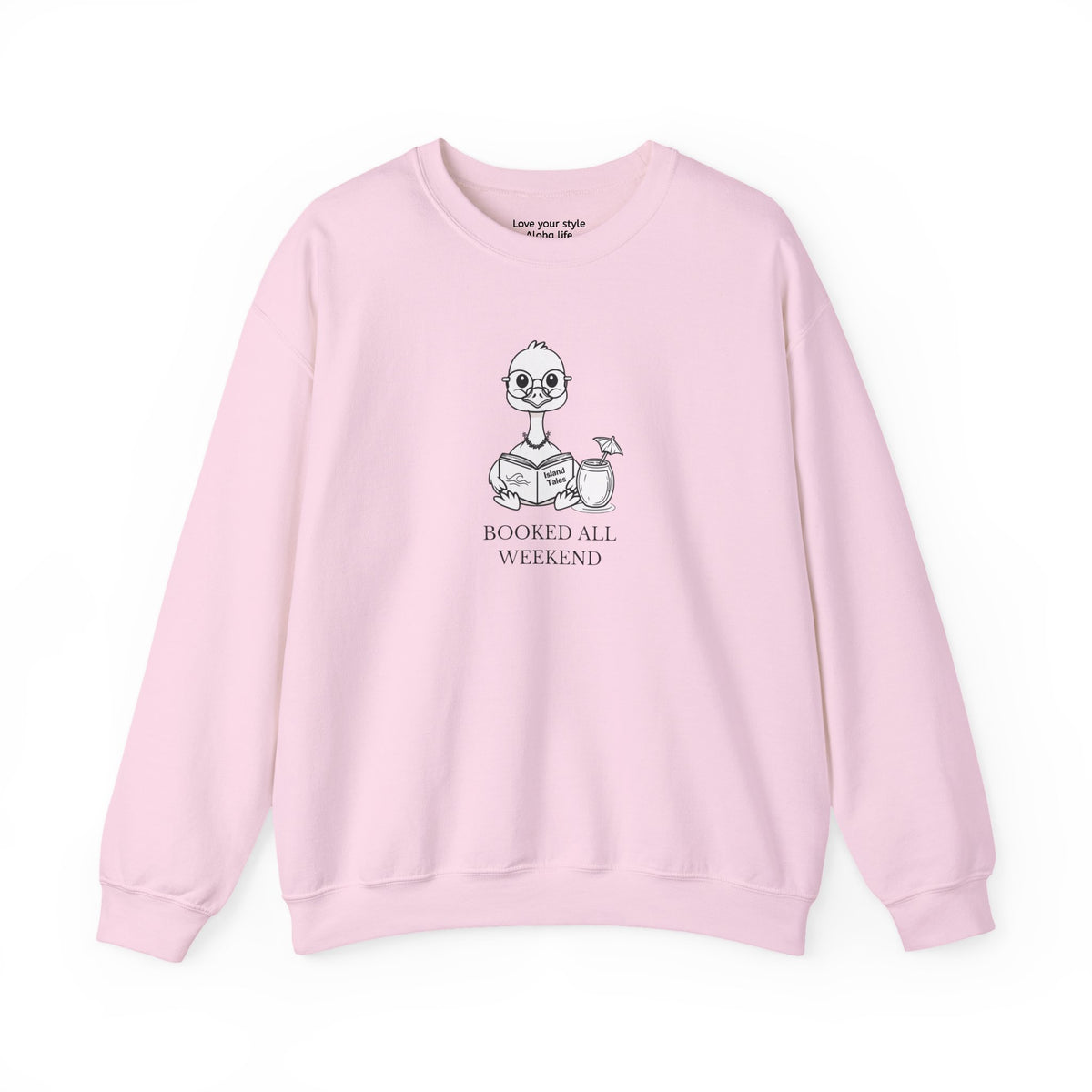 Pink sweatshirt with graphic print of a cartoon nene goose sitting reading a book with a cocktail next to it with text 'BOOKED ALL WEEKEND'