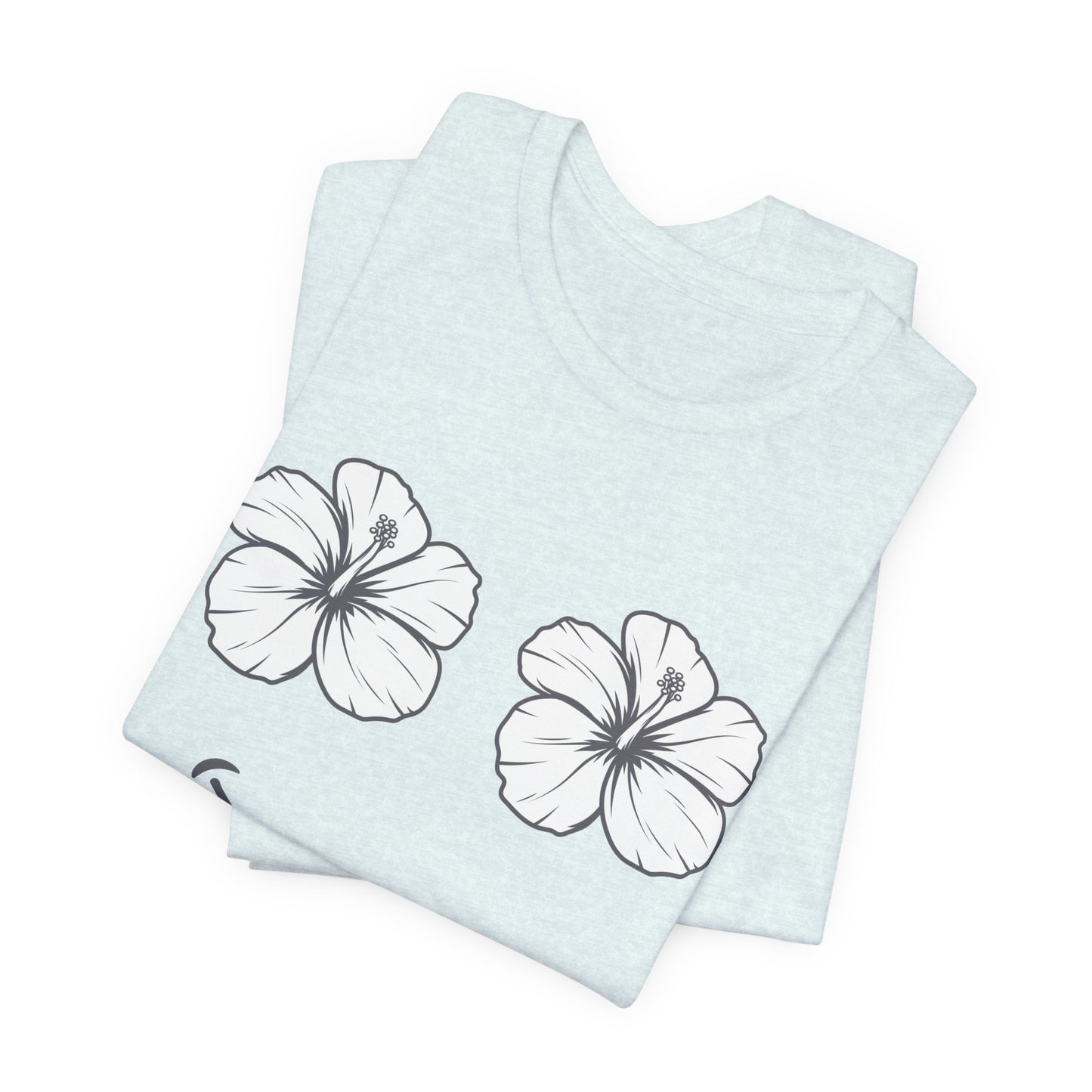 A folded light blue heather t-shirt featuring two white hibiscus flower graphics outlined in black, displayed on a clean white background.