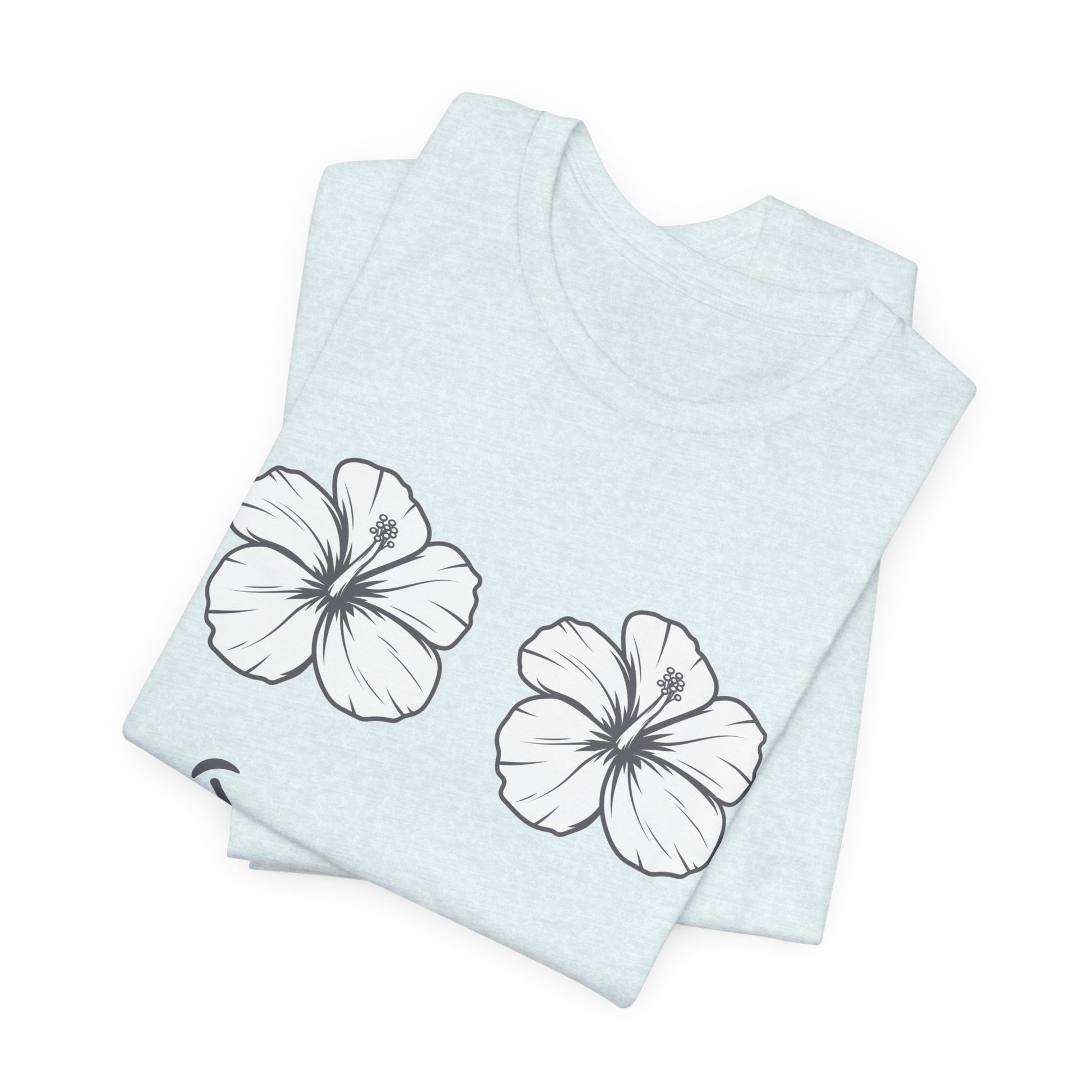 A folded light blue heather t-shirt featuring two white hibiscus flower graphics outlined in black, displayed on a clean white background.