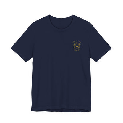 A navy short-sleeve t-shirt shown from the front, featuring a gold-colored retro graphic of a classic car between two palm trees with the text 'ALOHA DREAMIN'' and 'Kailua, HI' on the left chest.
