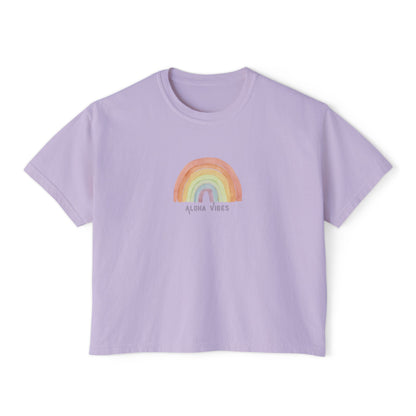 A lavender short-sleeve crop top t-shirt featuring a colorful watercolor-style rainbow graphic on the chest with the text 'ALOHA VIBES' underneath, displayed on a clean white background.