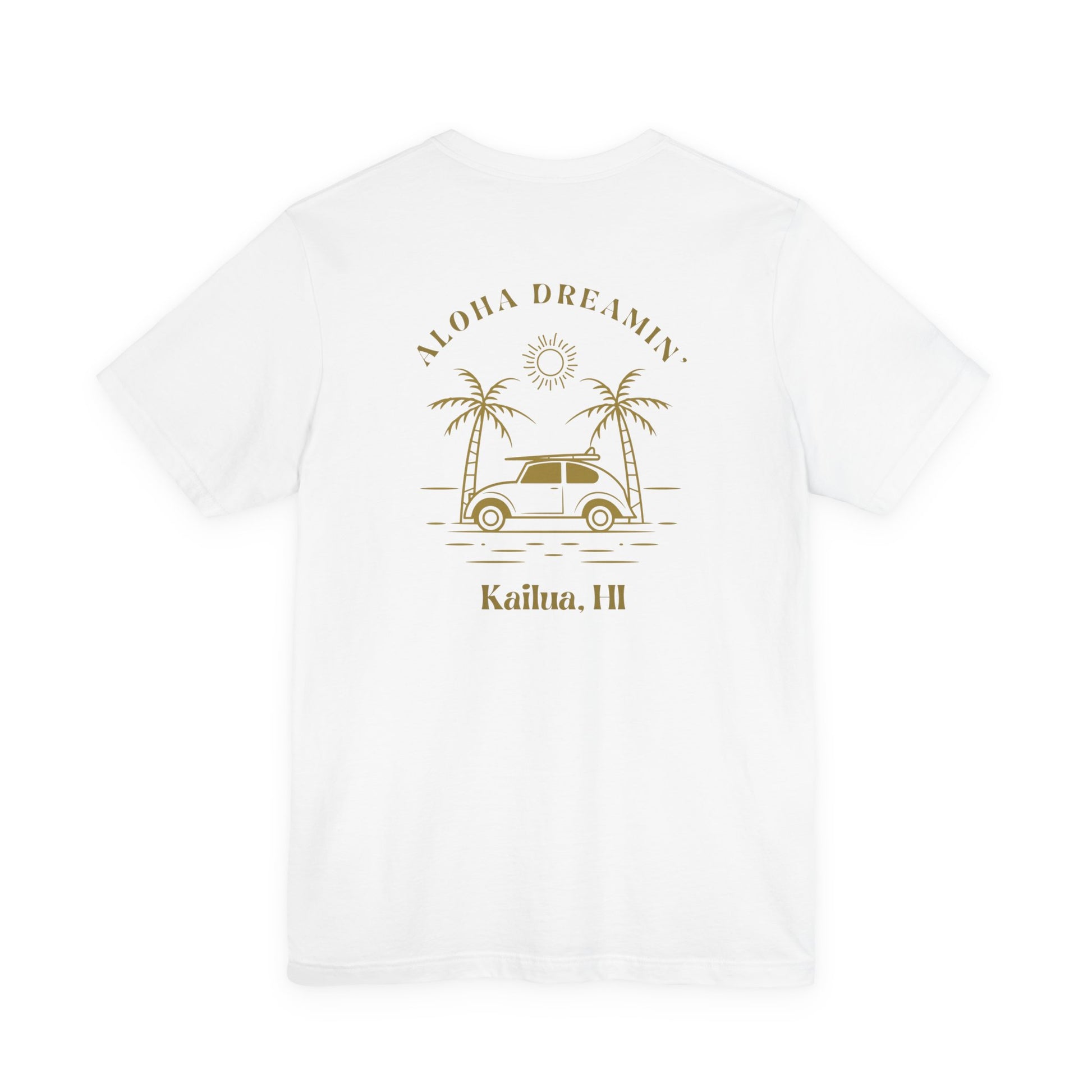 A white short-sleeve t-shirt shown from the back, featuring a gold-colored retro graphic of a classic car between two palm trees with the text 'ALOHA DREAMIN'' and 'Kailua, HI'.