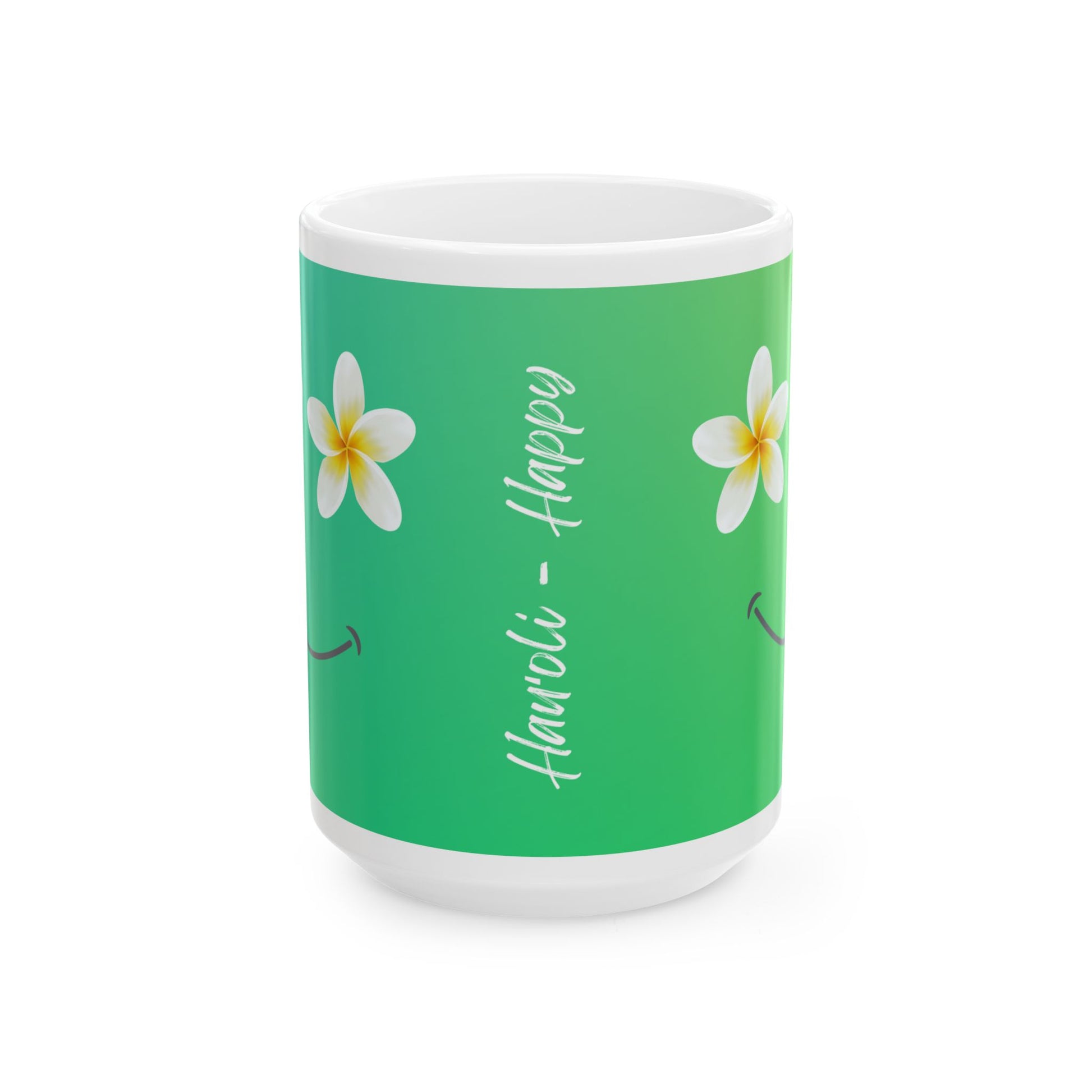 A white ceramic mug with a green wraparound design featuring white plumeria flowers and the vertical text 'Hauʻoli- Happy' in white script.
