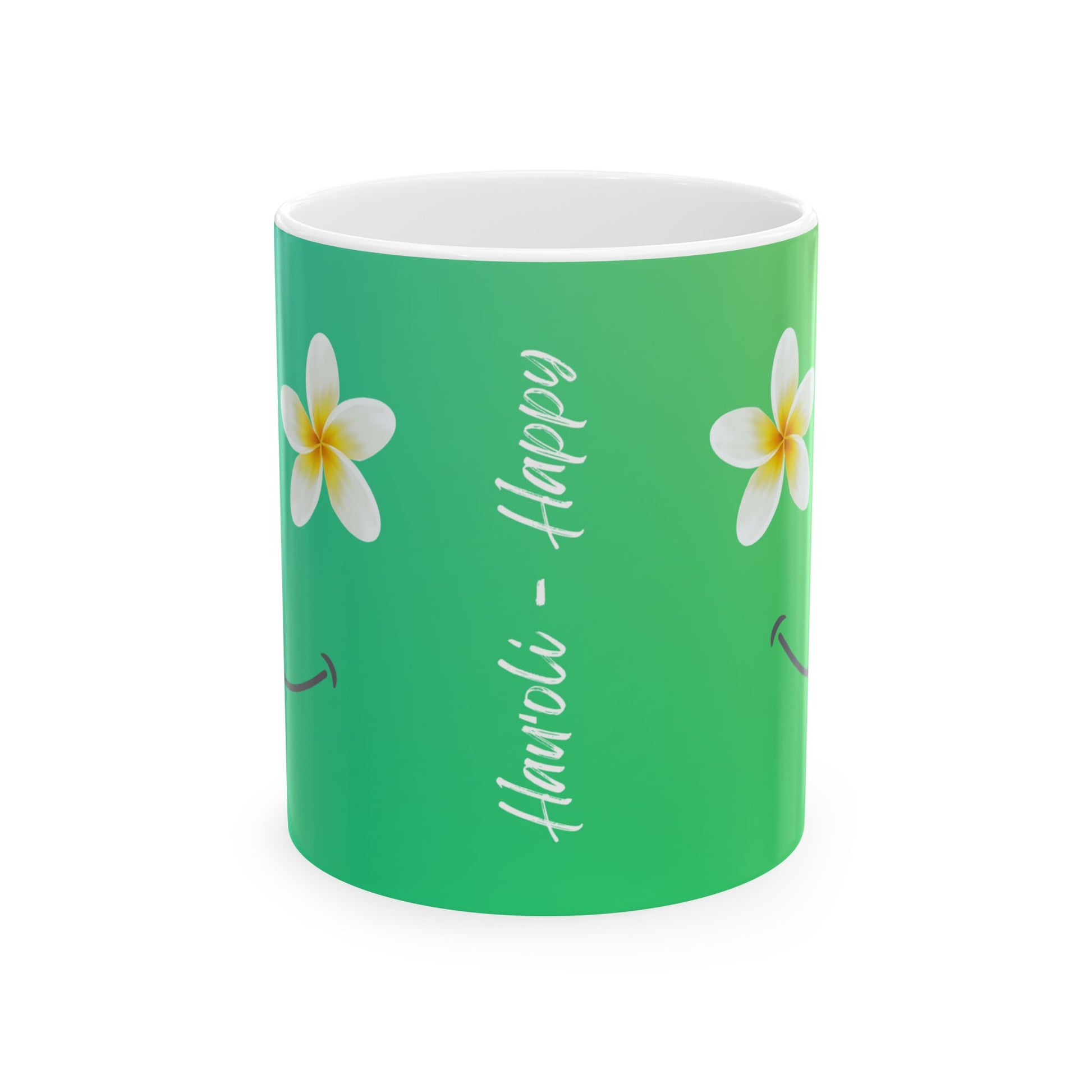 A green ceramic mug with a white interior, decorated with two white plumeria flowers and the words 'Hauʻoli - Happy' in white script.