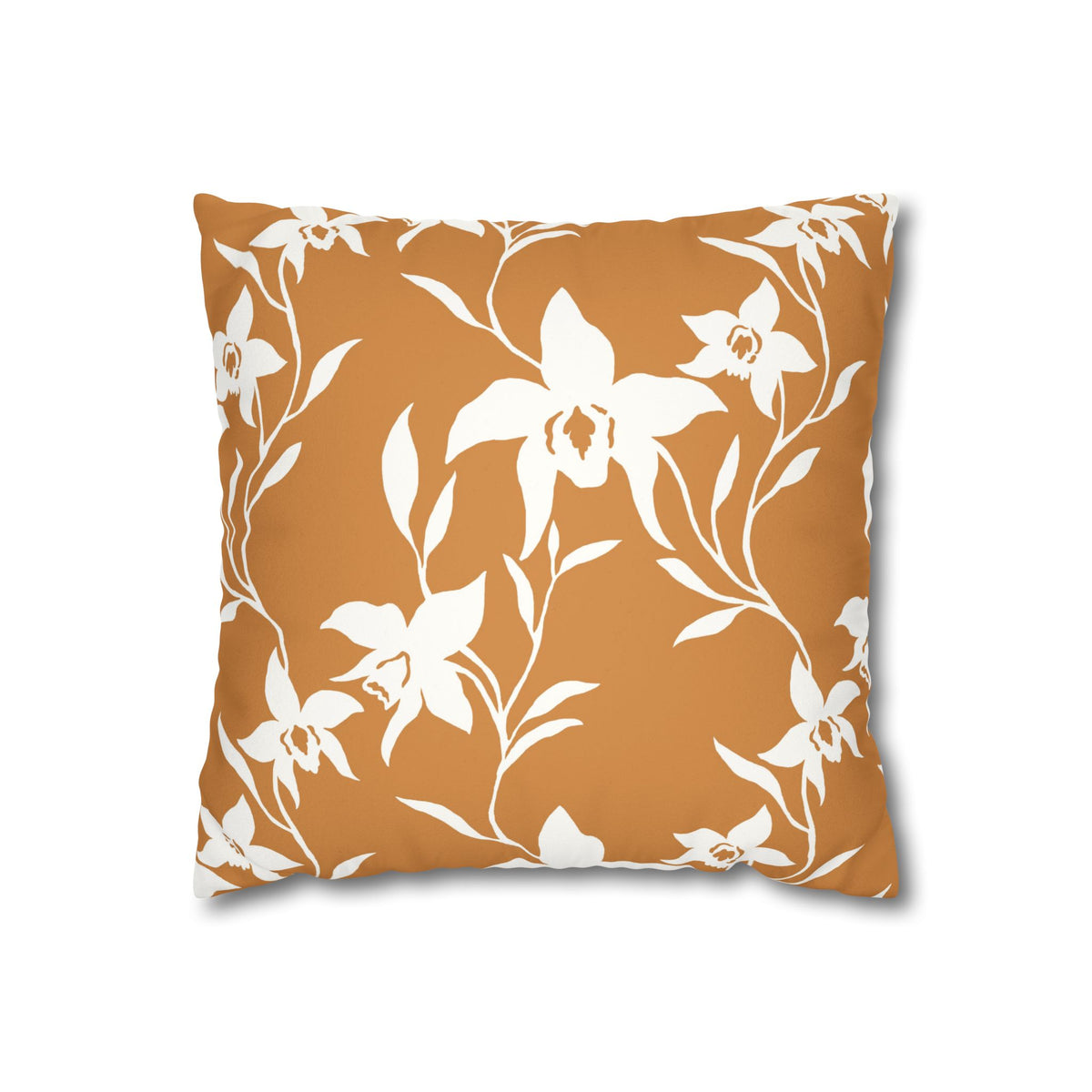 A square throw pillow featuring a white floral and leaf pattern on a warm terracotta orange background, shown against a plain white studio backdrop.