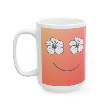 A white ceramic mug featuring a printed design of two white hibiscus flowers serving as eyes and a curved smile on a peach-to-pink gradient background.