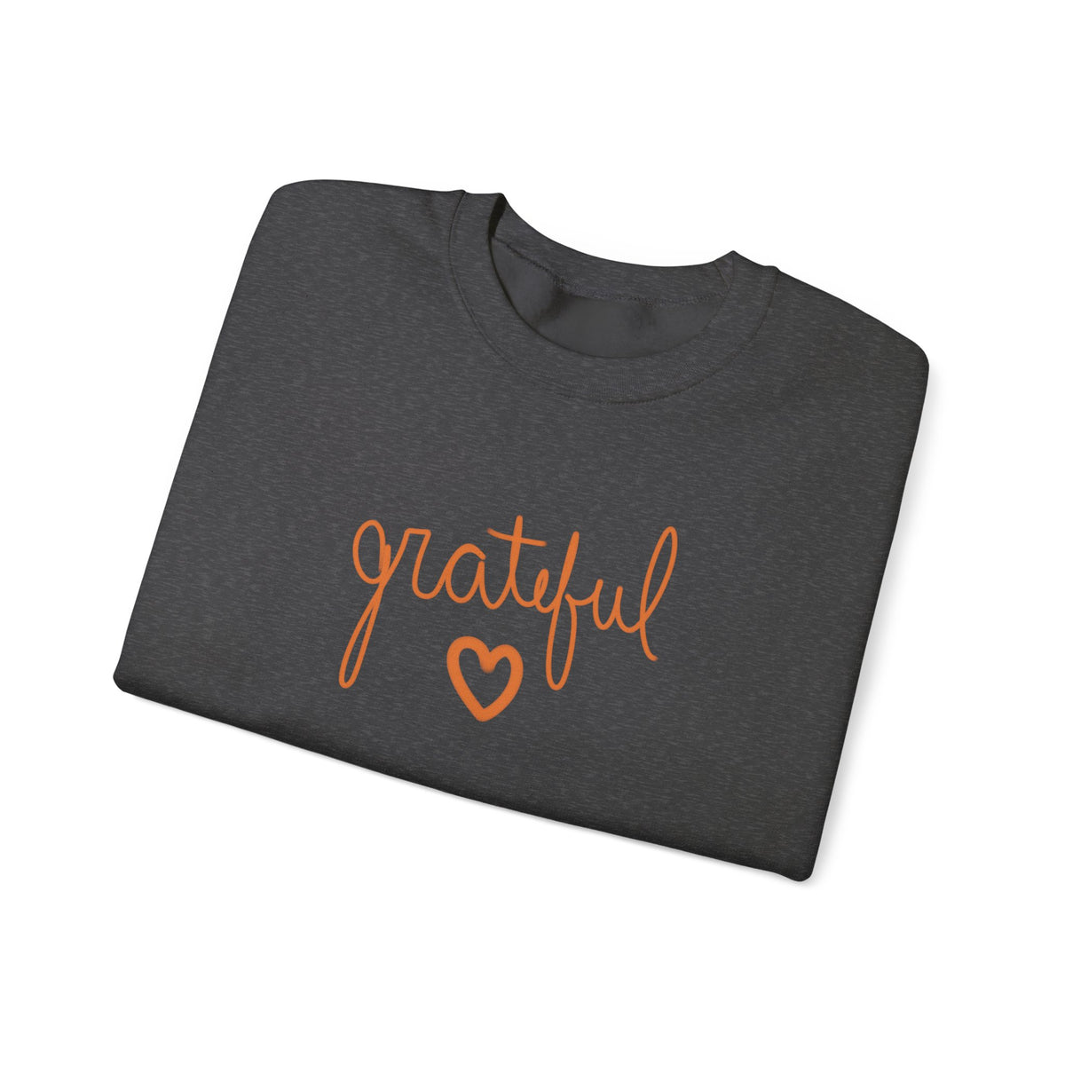 A folded dark grey crewneck sweatshirt featuring the word 'grateful' in orange cursive script and an orange heart outline on the front, set against a plain white background.