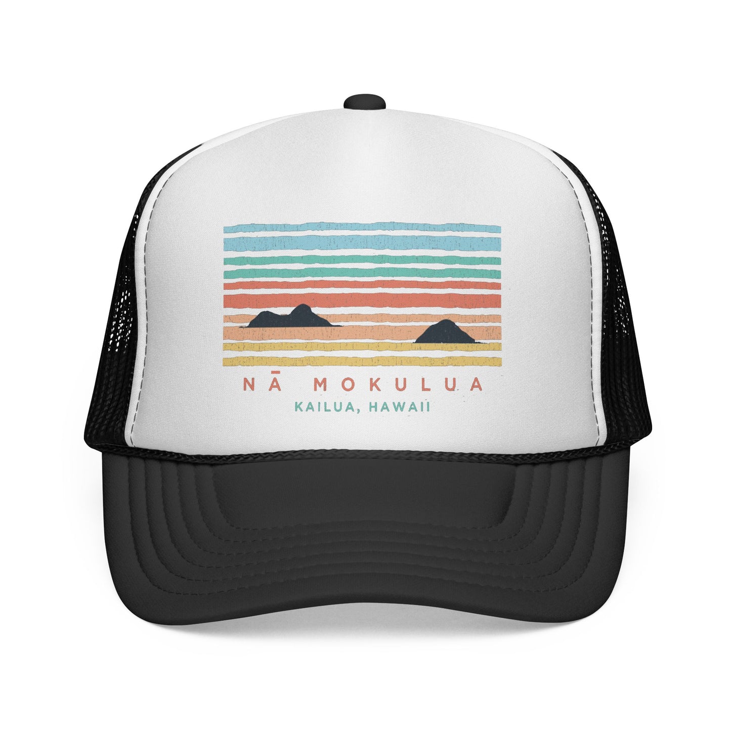 A white and black trucker hat featuring a colorful retro sunset graphic with the text 'NÁ MOKULUA KAILUA, HAWAII' on the front panel.