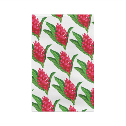 Red ginger Hawaiʻi kitchen towel with bright red tropical flowers and green leaves on white
