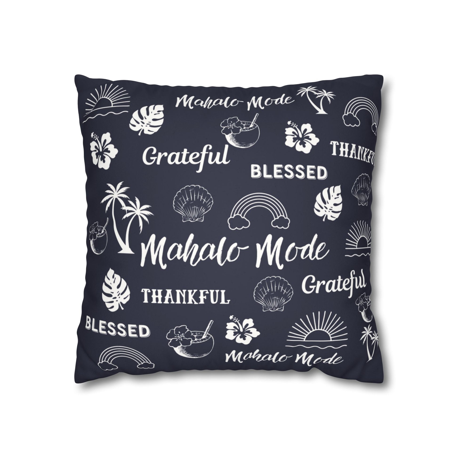 A square throw pillow in dark navy blue with a white tropical-themed print featuring palm trees, hibiscus flowers, seashells, rainbows, and words like 'Mahalo Mode', 'Grateful', and 'Blessed'.