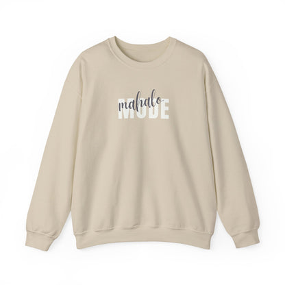 A beige crewneck sweatshirt with 'mahalo MODE' printed across the chest, featuring 'mahalo' in a dark gray script font and 'MODE' in a white block font, displayed on a clean white background.